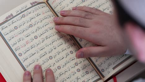 man reading quran in mosque 1