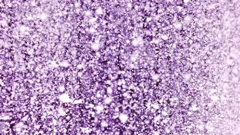 slow motion snowfall with thick, clustered snowflakes near violet textured wall