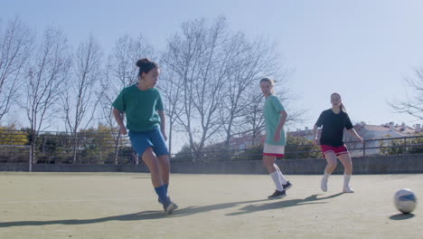 two teenage girls celebrating after successful goal