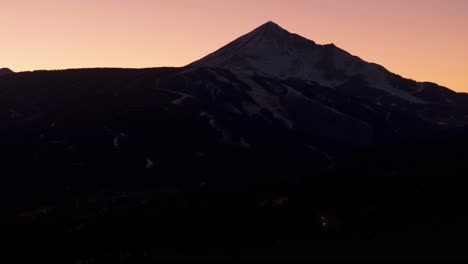 drone shot panning up of lone mountain in big sky, montana at sunset