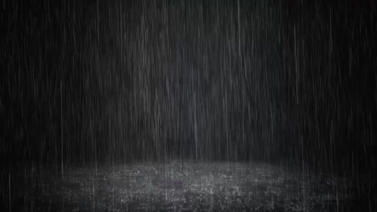 Intense Rain Falling Against a Dark Background