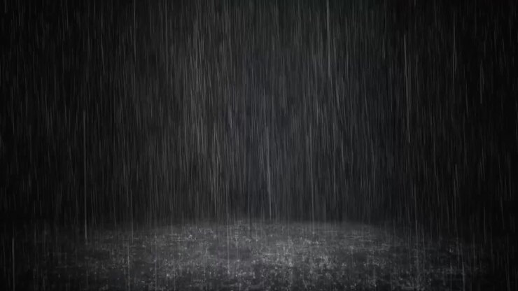 Intense Rain Falling Against a Dark Background
