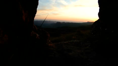 mountain sunset over the peak rock. dark key sunset light in the mountains parallax rocks rock grass