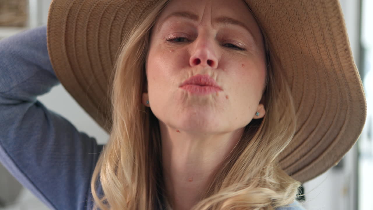 Woman wearing a hat indoors