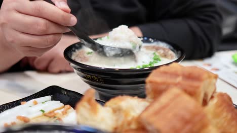 savoring traditional hong kong rice porridge meal