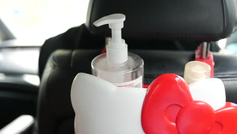 close up of hand sanitizer in a car ,