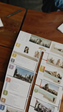 historical documents and images on a wooden table