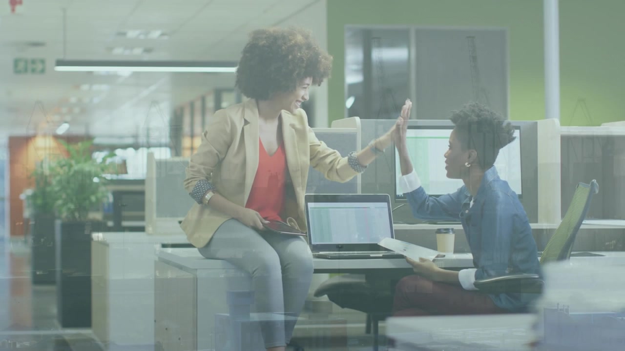Animation of cityscape over businesswomen in office