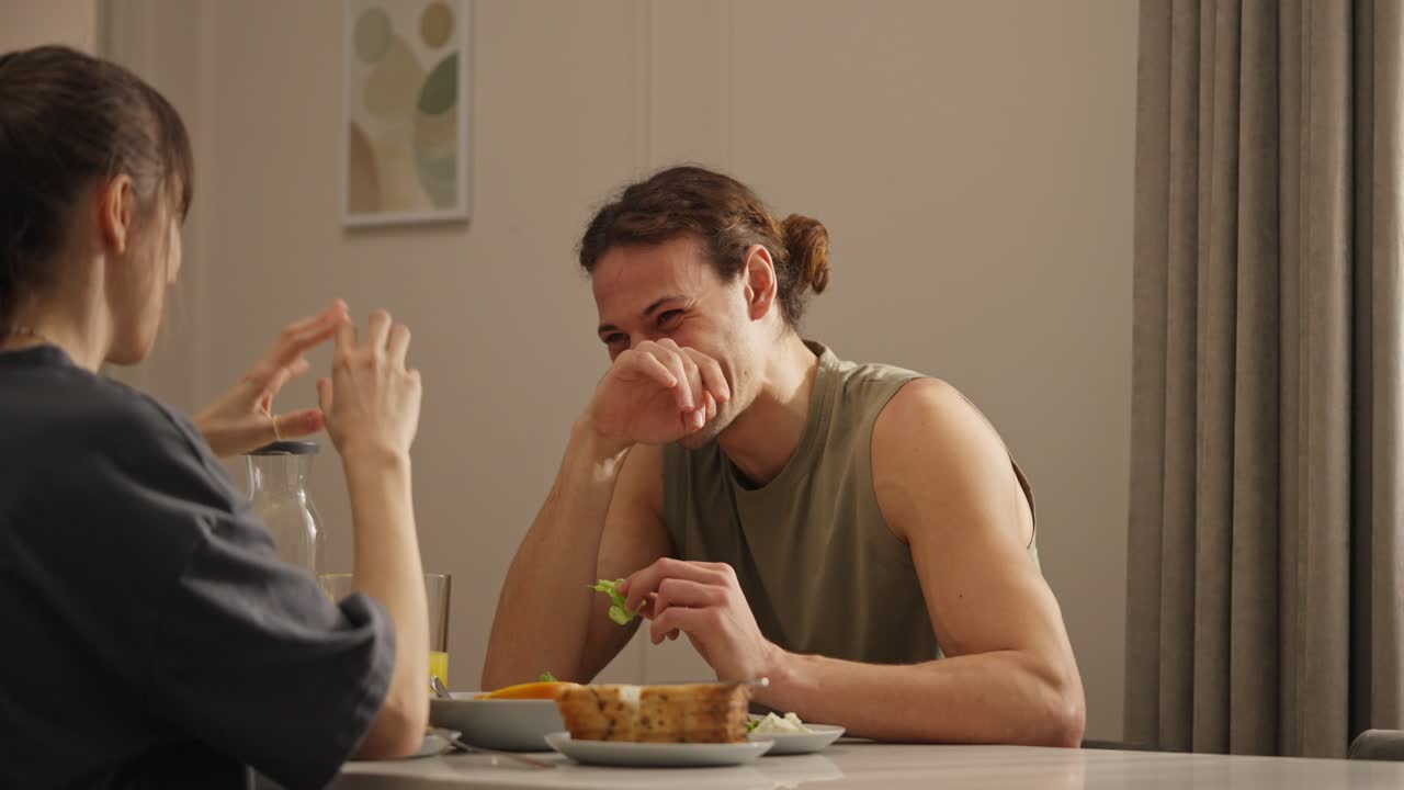 Couple having meal indoors