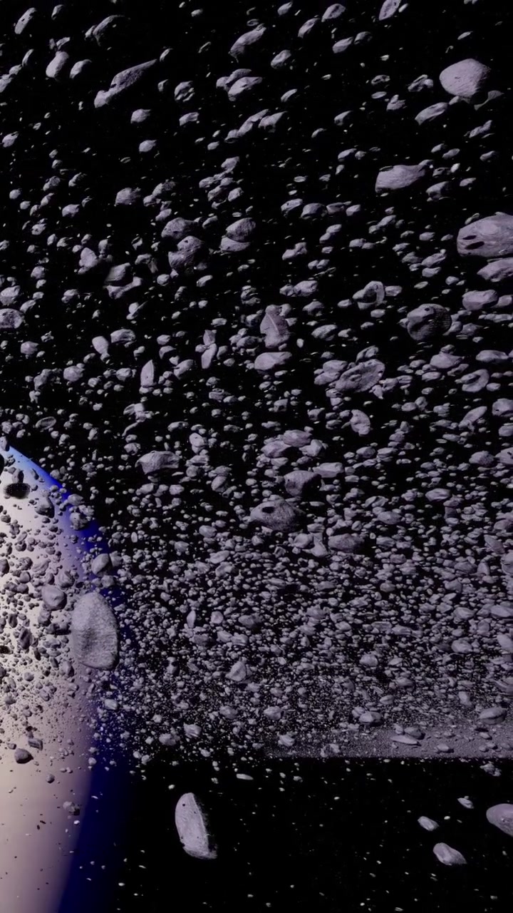 Asteroidi che fluttuano nello spazio con sfondo scuro e luce blu.