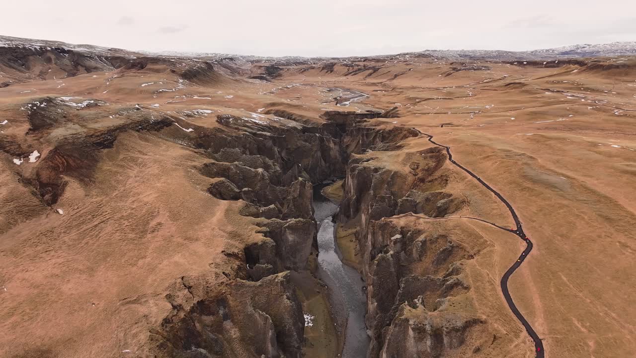 aerial - deep canyon cliffs and river Fjaðrárgljúfur Kirkjubæjarklaustur Iceland