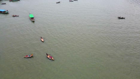 passenger boats at buriganga river in dhaka, bangladesh - aerial drone shot