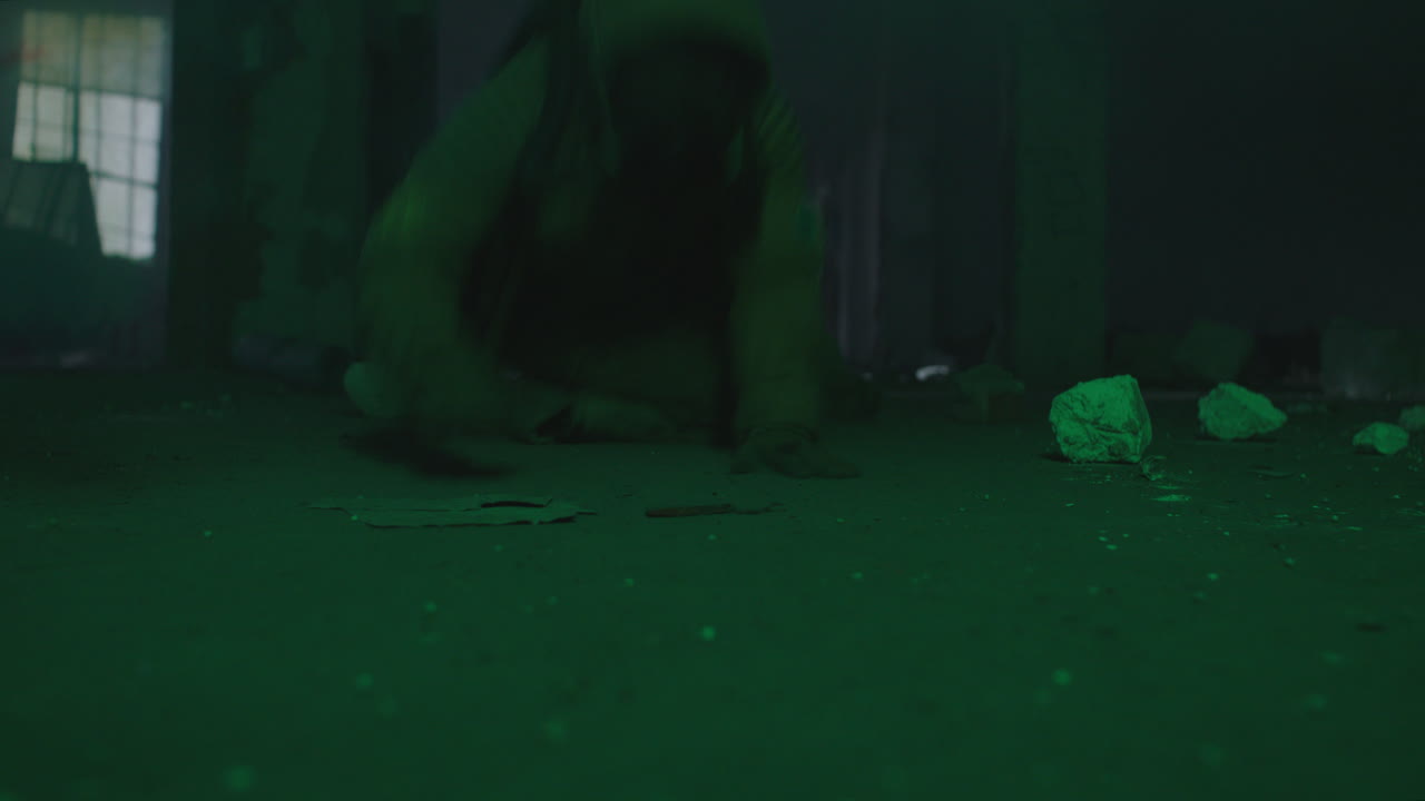 A wounded soldier in the abandoned military complex approaches anomaly