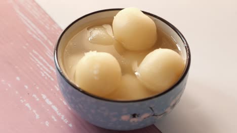 close up of indian sweet in a bowl on table.