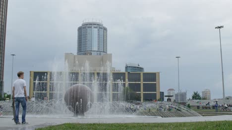 urban park scene with fountain and skyscrapers