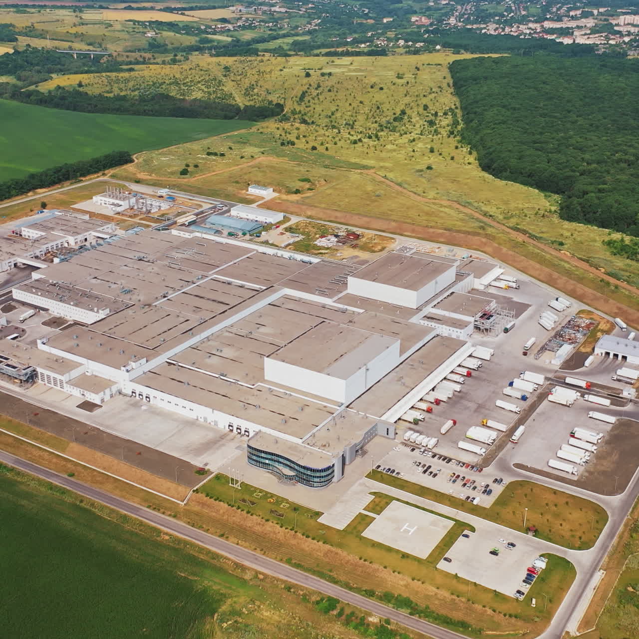 Aerial shot of large industrial complex, factory, building