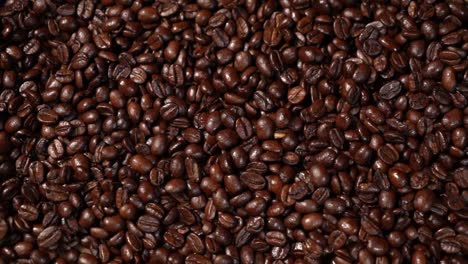 slow pan across dark coffee beans. hd