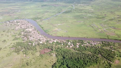 wjde shot of village and farmland in background along oueme river