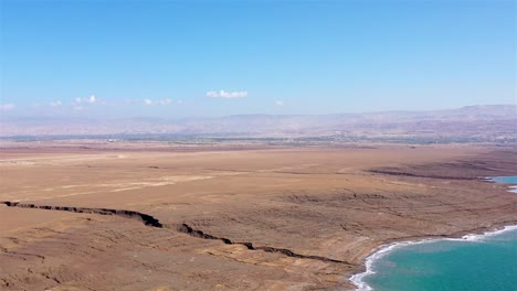 panoramic aerial view of the dead sea landscape with sinkholes and arid desert