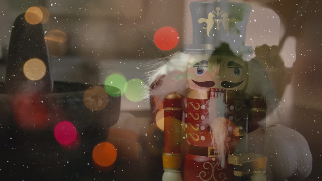 Animation of snow falling over christmas decorations