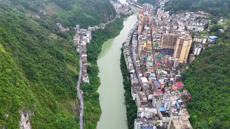 Yanjin,-the-narrowest-city-in-the-world-flowed-by-the-Nanxi-River,-Yunnan-Province,-China_-UHD-drone