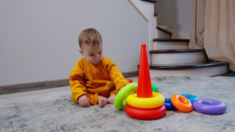 baby playing with stacking rings
