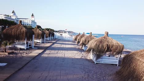 luxury beach resort with cabanas and straw umbrellas