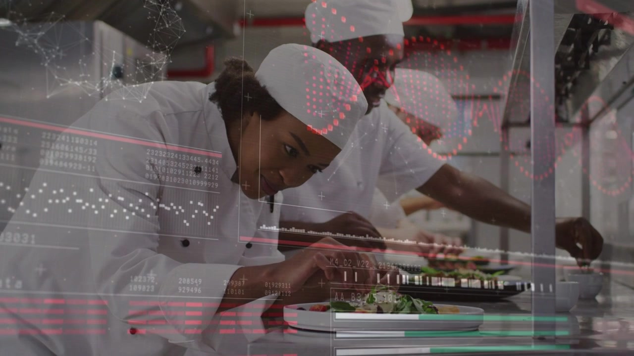 Lead woman chef leaning placing herb driving kitchen service while red overlay shifting across pass