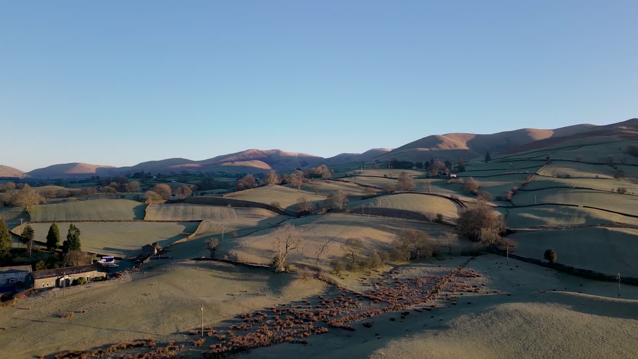 Stunning Drone footage of sunrise in the Yorkshire Dales above the village of Sedbergh. Dawn sunrise above the hills and misty landscape of the Yorkshire dales national Park.