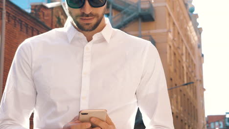 man using smartphone in the city