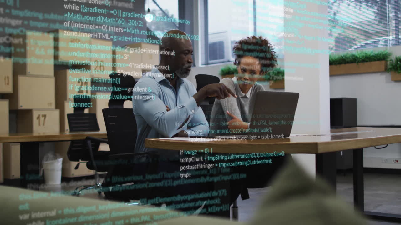 Collaborating on animation project, diverse colleagues using laptop in modern office