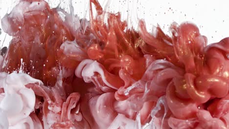 white and red gold ink in water