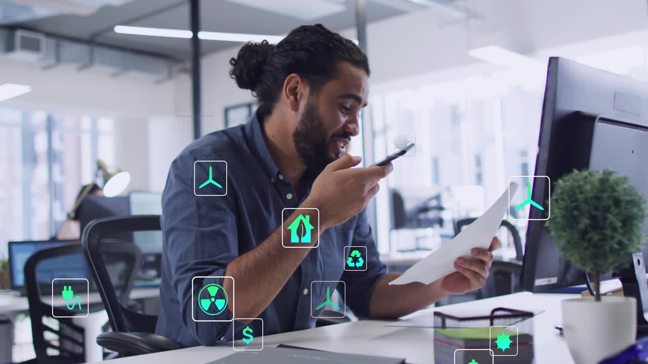 Man reading doc and glancing at phone, speaking into phone, capturing finance data as icons growing