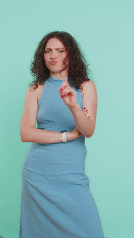 woman reacting to unpleasant awful idea dissatisfied wave hand shake head no dismiss idea
