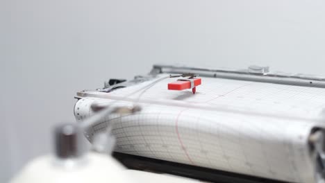 Close-up-of-a-chart-recorder-drawing-a-graph-during-flour-quality-testing