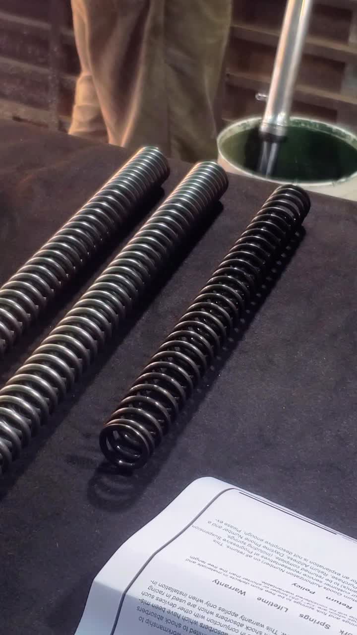 Detailed view of high-quality suspension springs and technical charts, emphasizing the meticulous process of selecting performance components