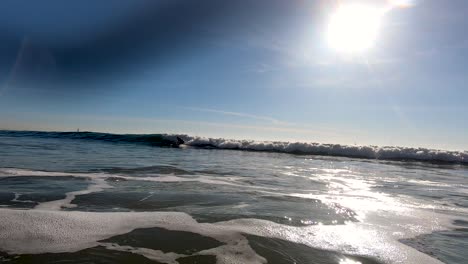 A-surfer-falls-into-a-wave-in-slow-motion-at-Venice-Beach-in-LA