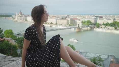 woman sitting and enjoying the budapest view