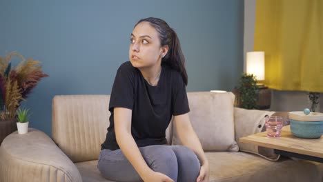 fearful young woman. she is in a bad mood at home.