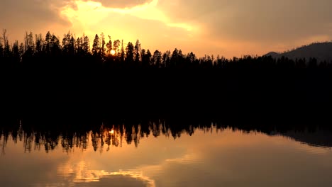 Vertical-footage-of-sunset-over-a-lake-in-the-Yellowstone-National-Park