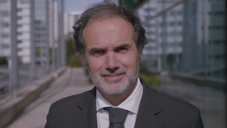 portrait of smiling mature businessman in suit