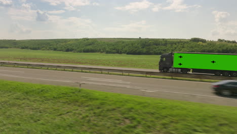 truck on highway with green screen trailer