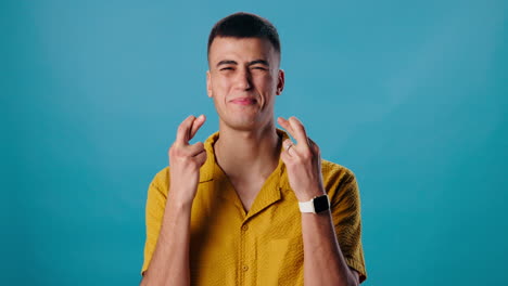 man crossing fingers with hope