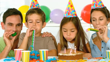 Smiling-family-celebrating-their-daughter-birthday