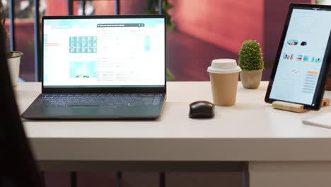 Empty-home-setup-desk-filled-with-documents-and-financial-reports