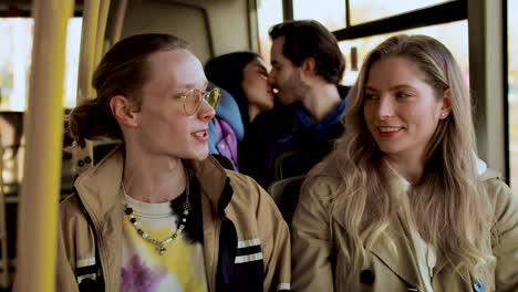 young man and woman talking in the bus