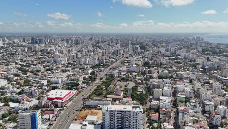 high-angle aerial view of 27 de febrero avenue in santo domingo, dominican republic, overlooking the cityscape and coastline