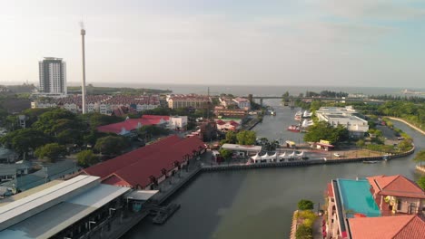 Aerial-shot-of-Menara-Taming-Sari-revolving-tower,-Malacca-City,-Malaysia