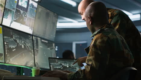 experts using tracking gear and radar systems in command center