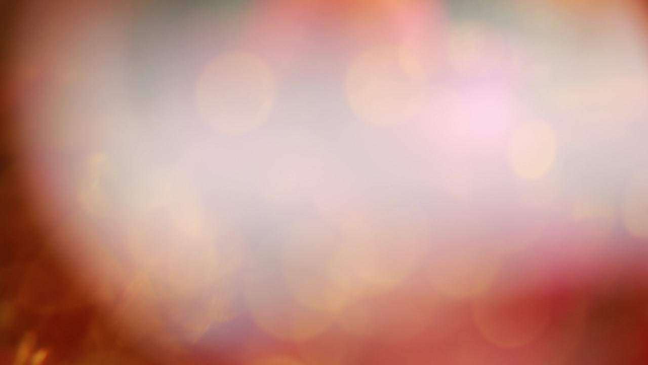Nettipattam, rozmazané abstraktní černé pozadí s bokeh efektem pro pozadí, s třpytivými jasnými rozostřenými bokeh a zlatými jiskrami.
